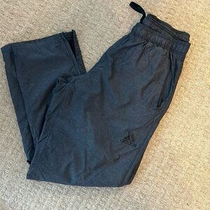 Adidas Mens L athletic pants. Nylon. Stretch drawstring waist. Zipper ankle.